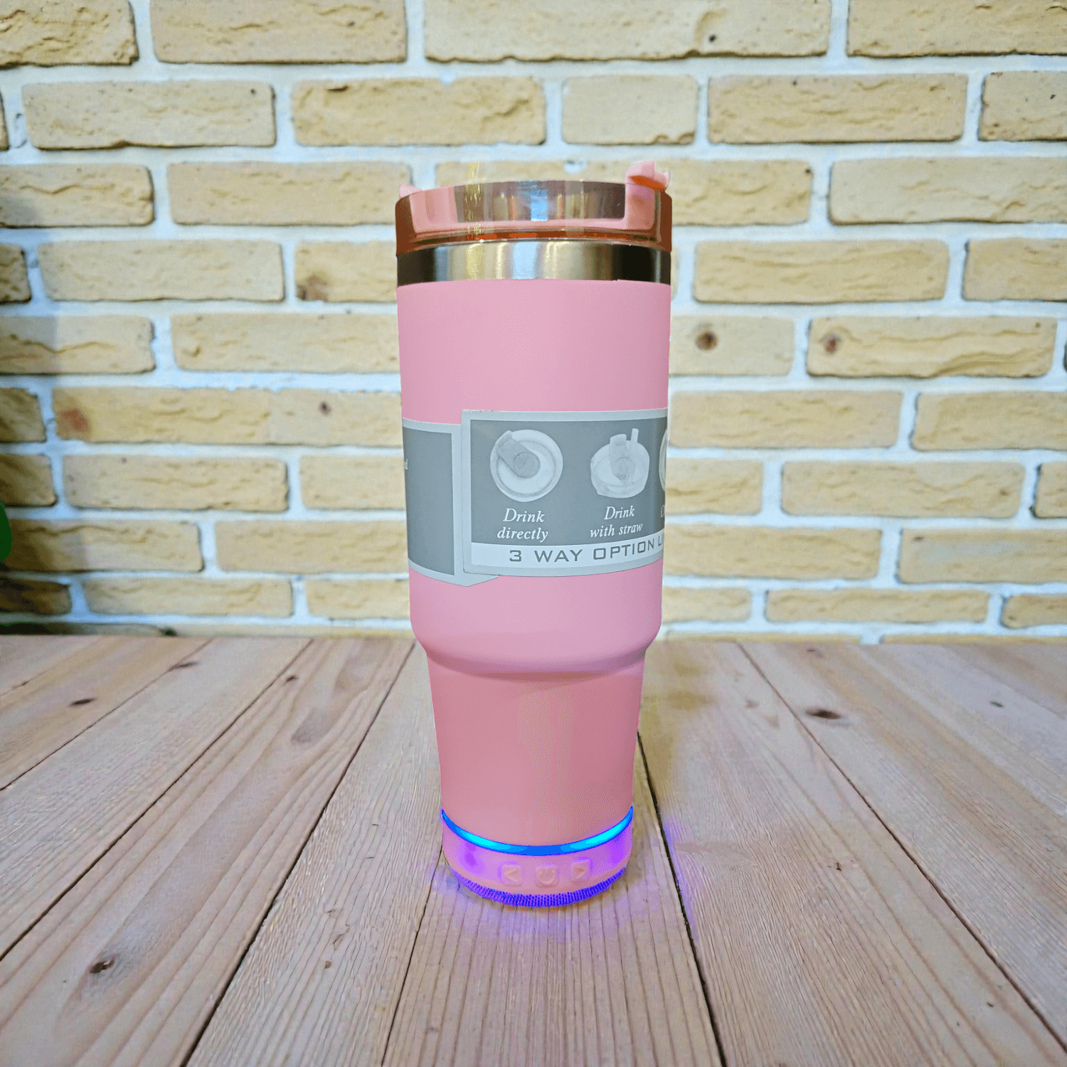 tumbler-with-speaker-pink-v1 Stainless Steel Insulated Tumbler with Bluetooth Speaker at Bottom - Image 1
